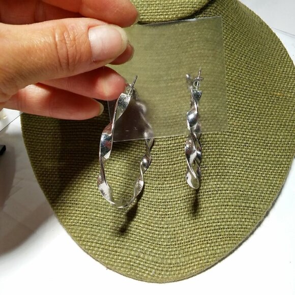 Women`s silver tone twist hoop earrings. 2 1/4 inc - Picture 2 of 3
